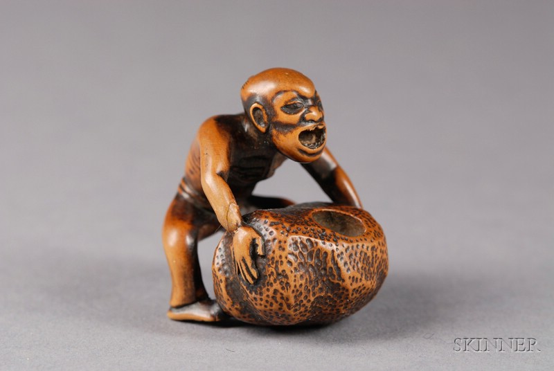 Appraisal: Boxwood Netsuke th century carving of a strongman lifting a