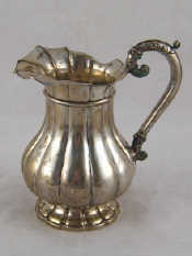 Appraisal: A th century Continental silver jug the ribbed baluster body