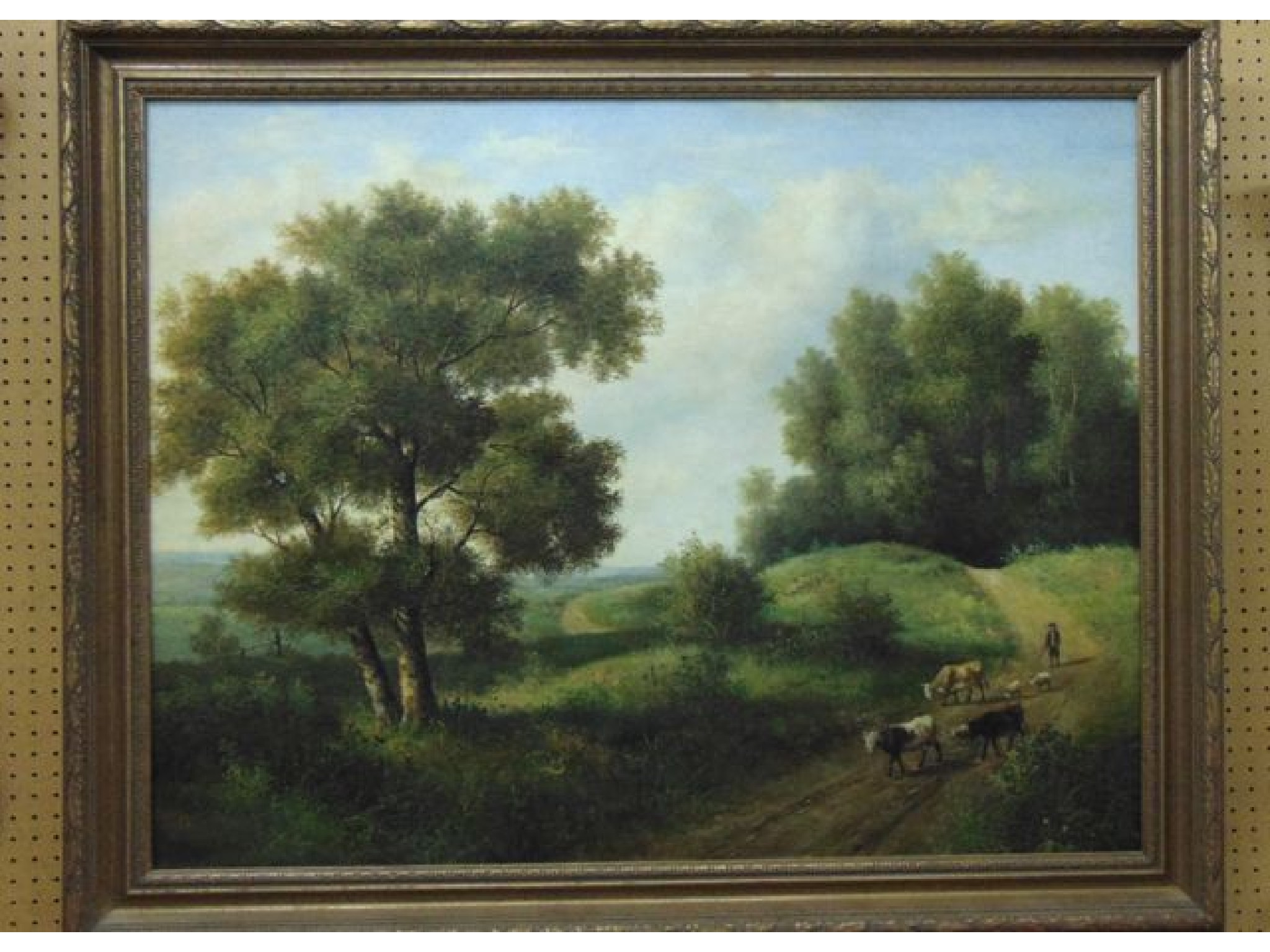 Appraisal: An oil on canvas showing an extensive landscape with drover