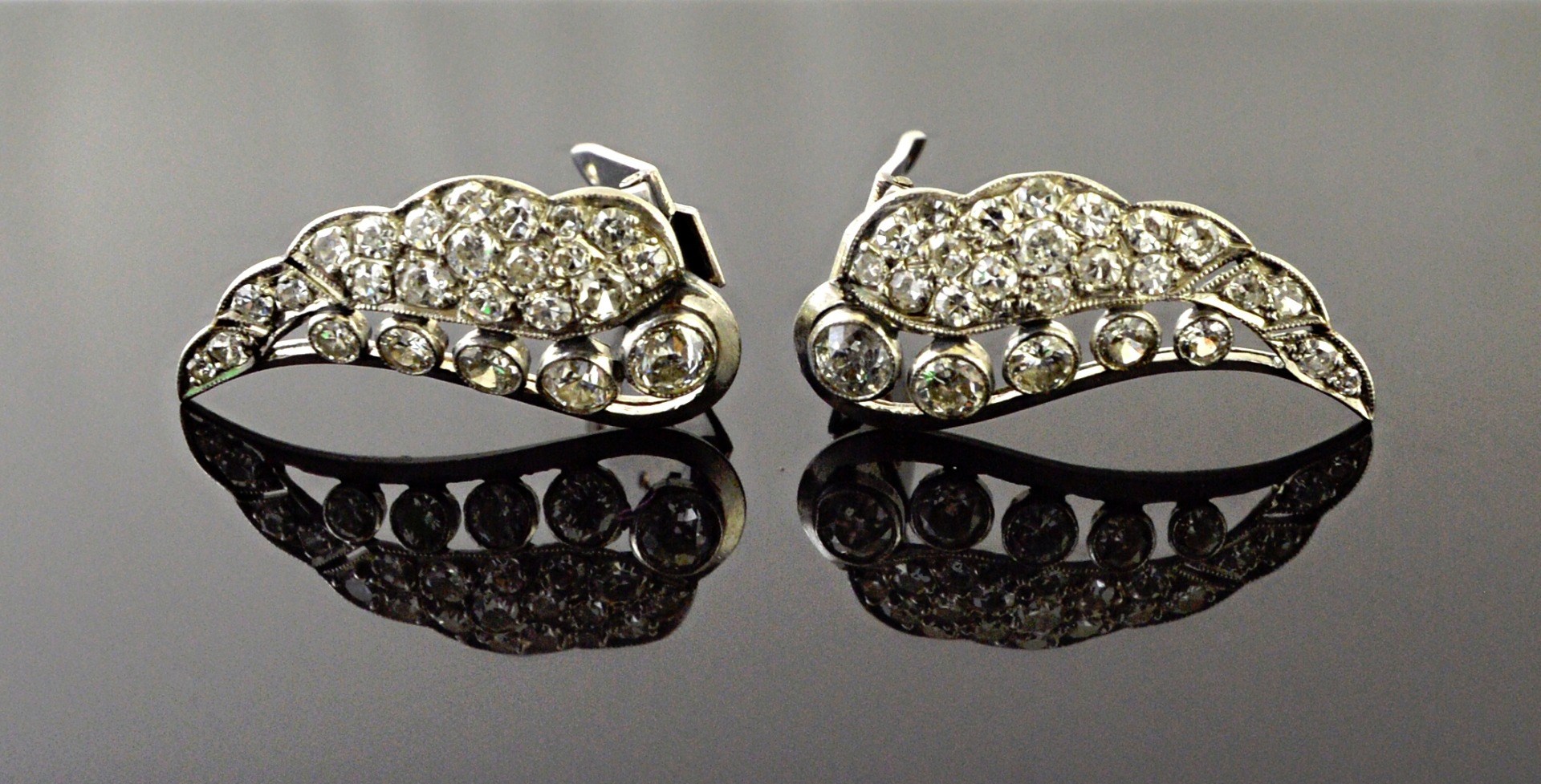 Appraisal: A pair of diamond set earclips each formed as a