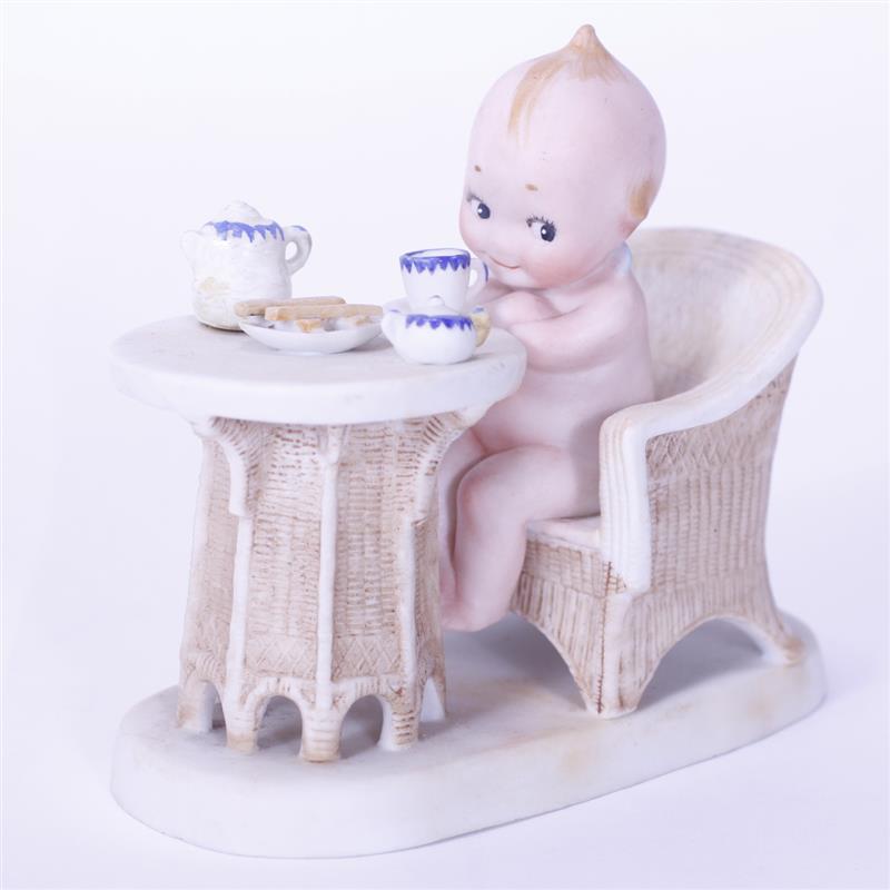 Appraisal: German Bisque Action Kewpie Doll Figure seated for breakfast Depose