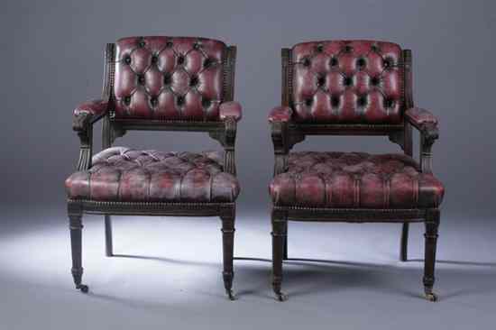 Appraisal: PAIR ENGLISH REGENCY CARVED MAHOGANY OPEN-ARM LIBRARY CHAIRS Early th