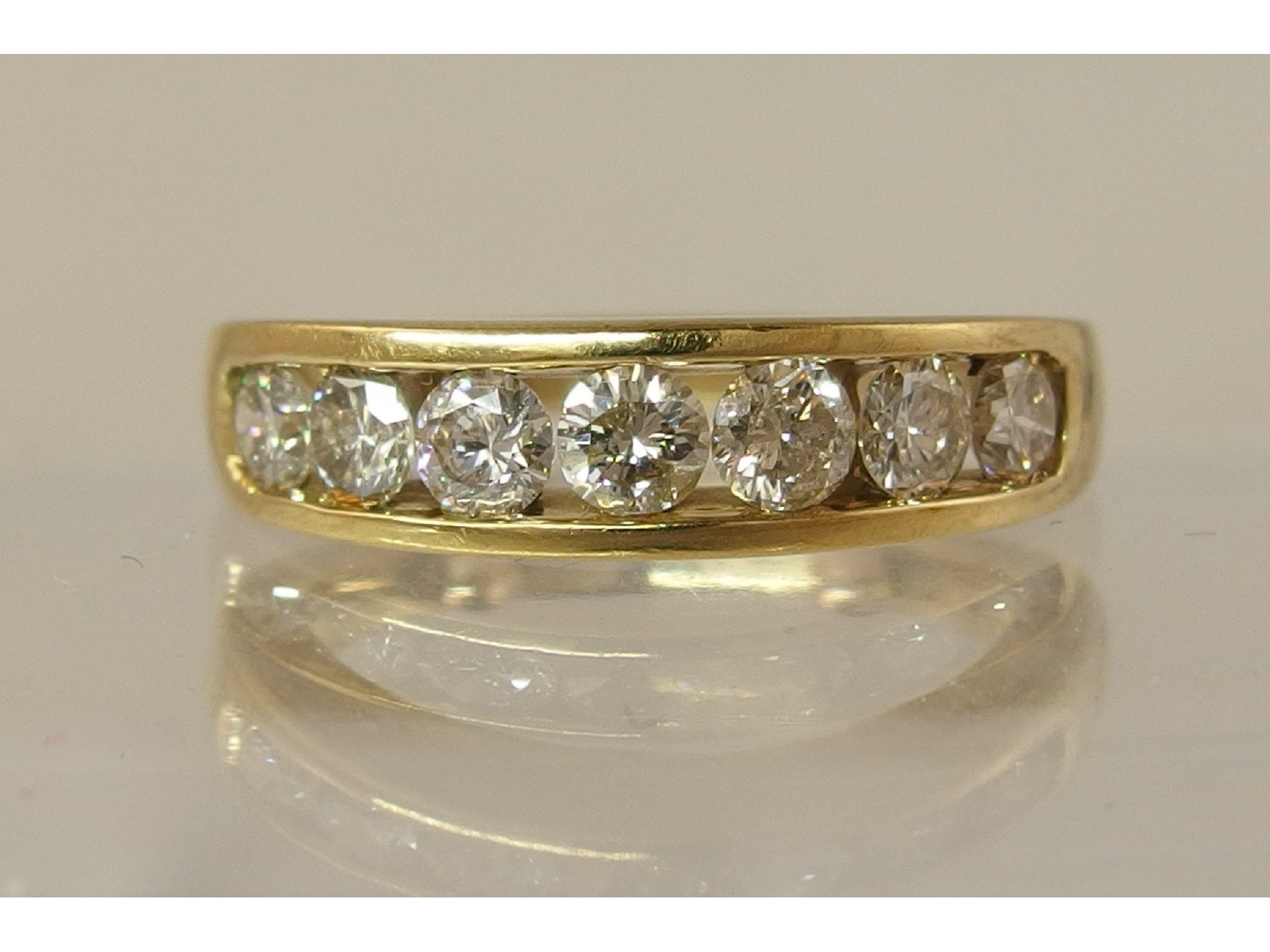 Appraisal: A ct yellow gold ct seven stone diamond ring each