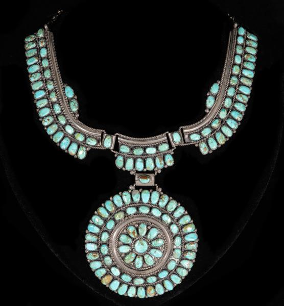 Appraisal: A FINE NAVAJO STERLING AND TURQUOISE CLUSTER NECKLACEThe elaborate cluster