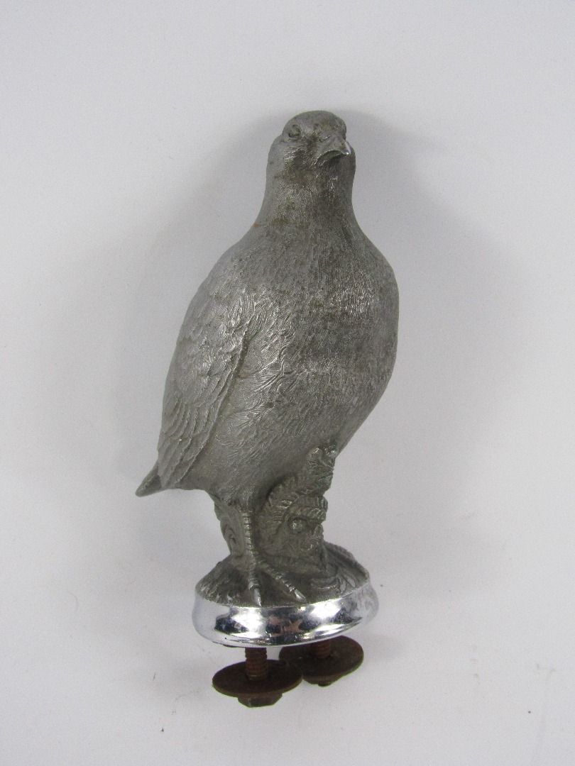 Appraisal: A matt cast metal car mascot modelled as a grouse