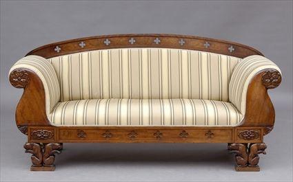 Appraisal: CONTINENTAL SETTEE The arched top rail pierced with quatrefoils flanked