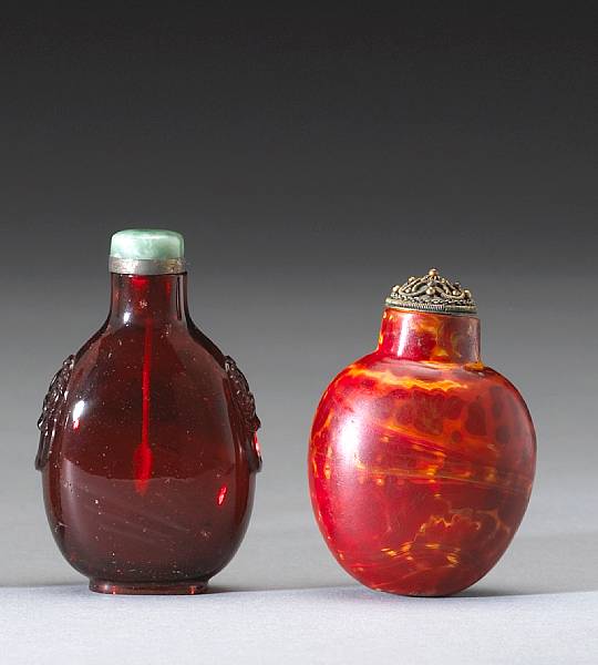 Appraisal: Two glass snuff bottles The first of translucent ruby glass