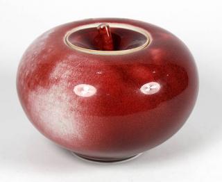 Appraisal: Art pottery apple form lidded jar having flambe glaze with