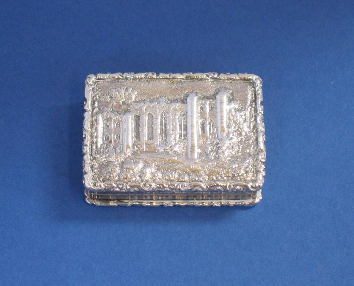 Appraisal: A WILLIAM IV CASTLE TOP VINAIGRETTE of rectangular form with