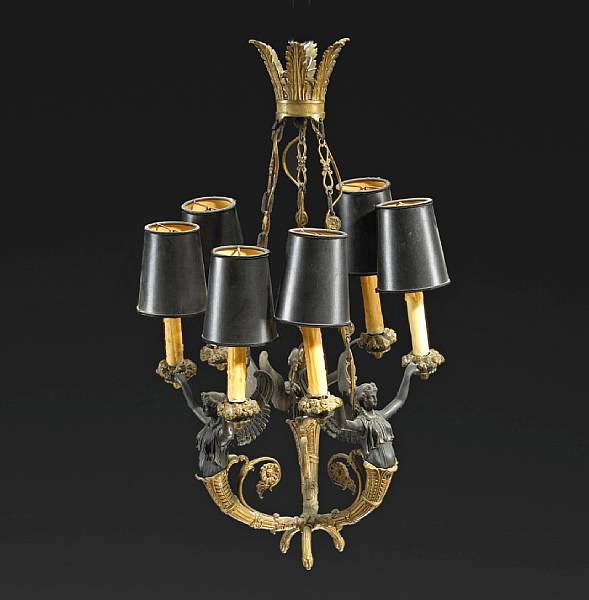 Appraisal: Empire style patinated and gilt bronze figural six light chandelier