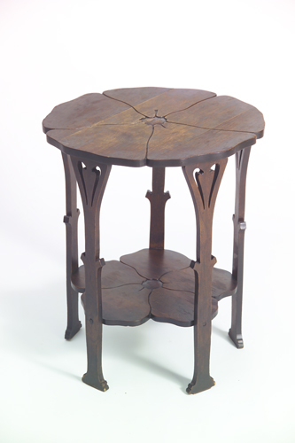 Appraisal: GUSTAV STICKLEY Mahogany Poppy tea table with floriform top and