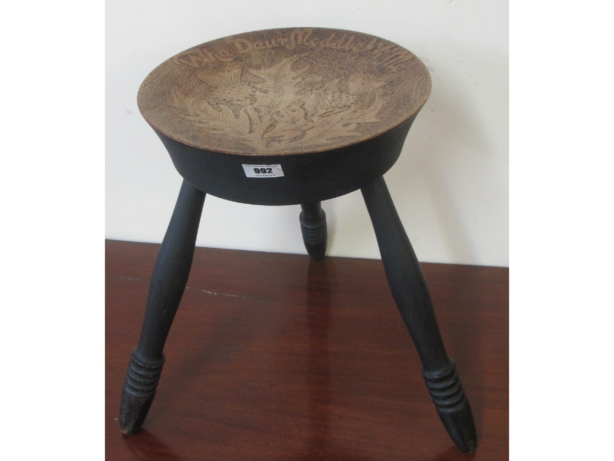 Appraisal: A Victorian pokerwork stool with thistle design to top