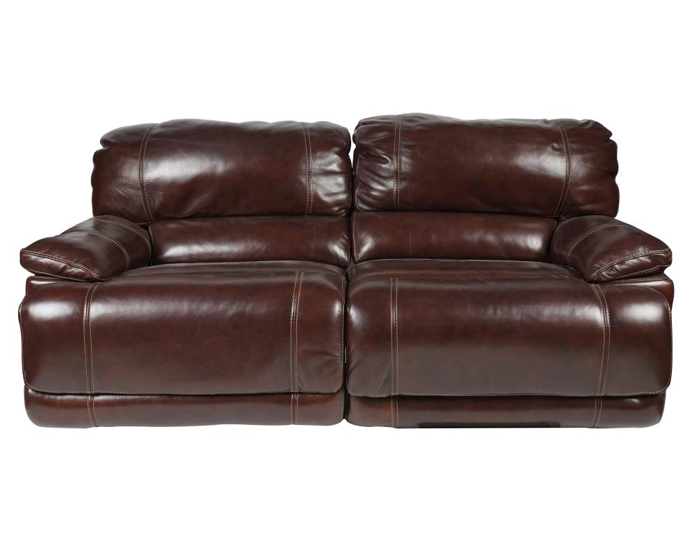 Appraisal: LEATHER RECLINING SECTIONAL SOFAcomprising two sections with electric reclining function