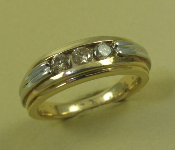 Appraisal: MAN'S DIAMOND AND FOURTEEN KARAT WHITE AND YELLOW GOLD RING