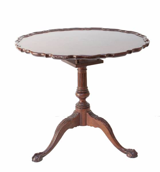 Appraisal: A George III style carved tilt top tea table height