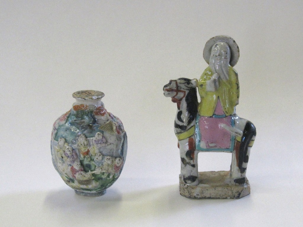 Appraisal: Oriental relief decorated scent bottle and a figure of a