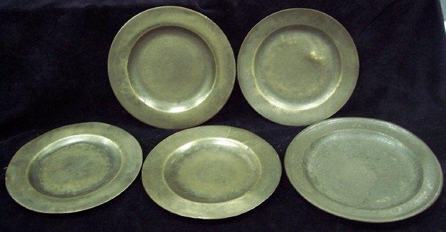 Appraisal: Four pewter plates cm diameter and another cm diameter