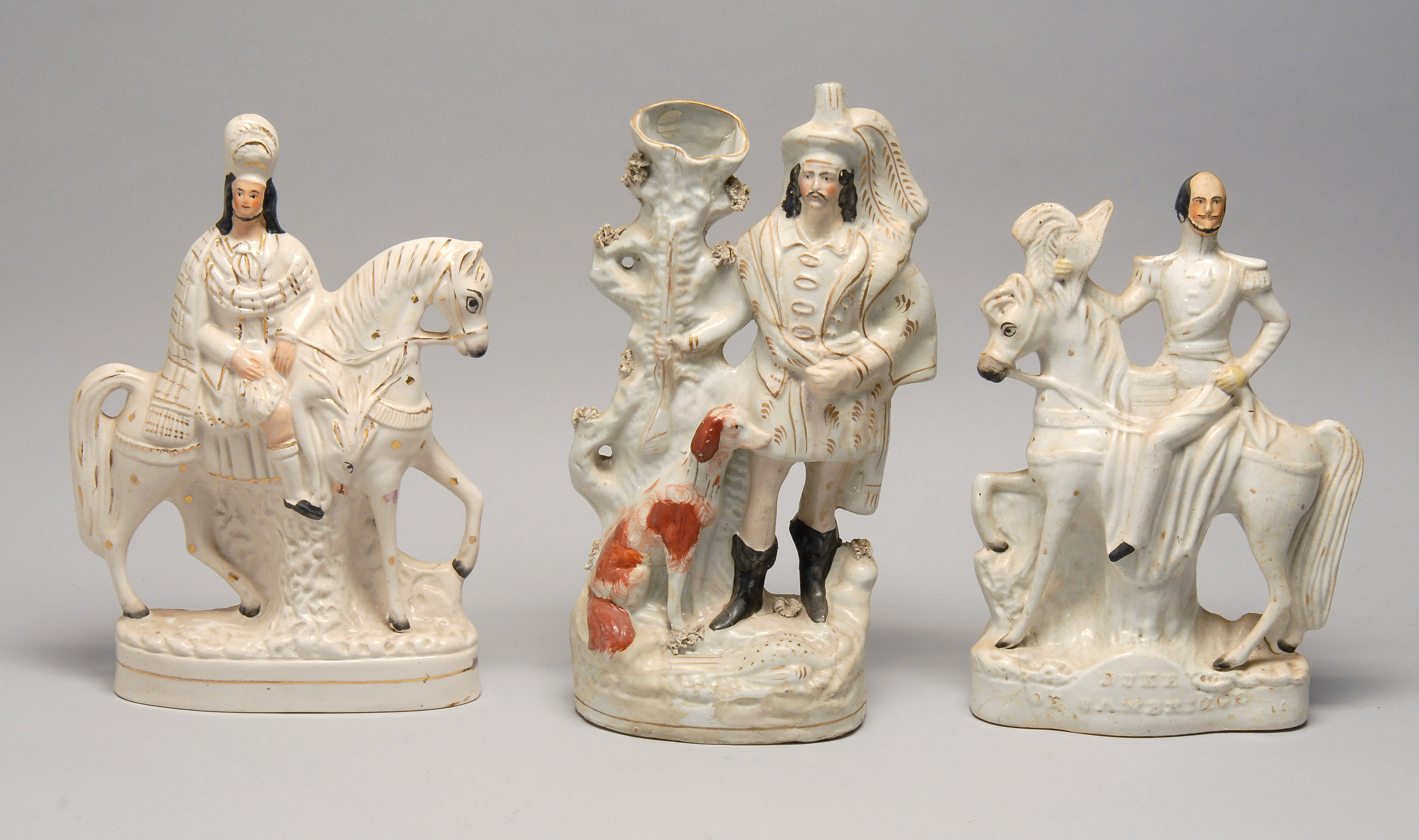 Appraisal: THREE TH CENTURY STAFFORDSHIRE POTTERY FIGURES With polychrome and gilt