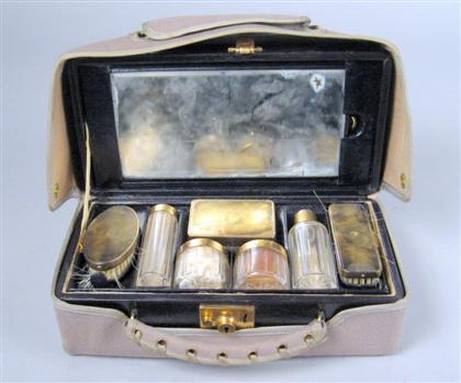 Appraisal: French silver gilt and glass travelling dressing kit mid th