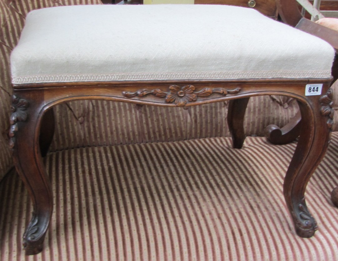 Appraisal: A th century rosewood foot stool on floral capped cabriole