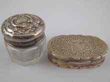 Appraisal: A silver pill box with engraved decoration hallmarked Birmingham measuring