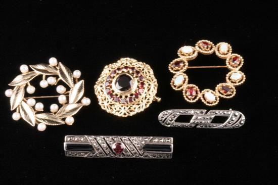 Appraisal: FIVE ASSORTED GOLD AND SILVER PINS k yellow gold circle