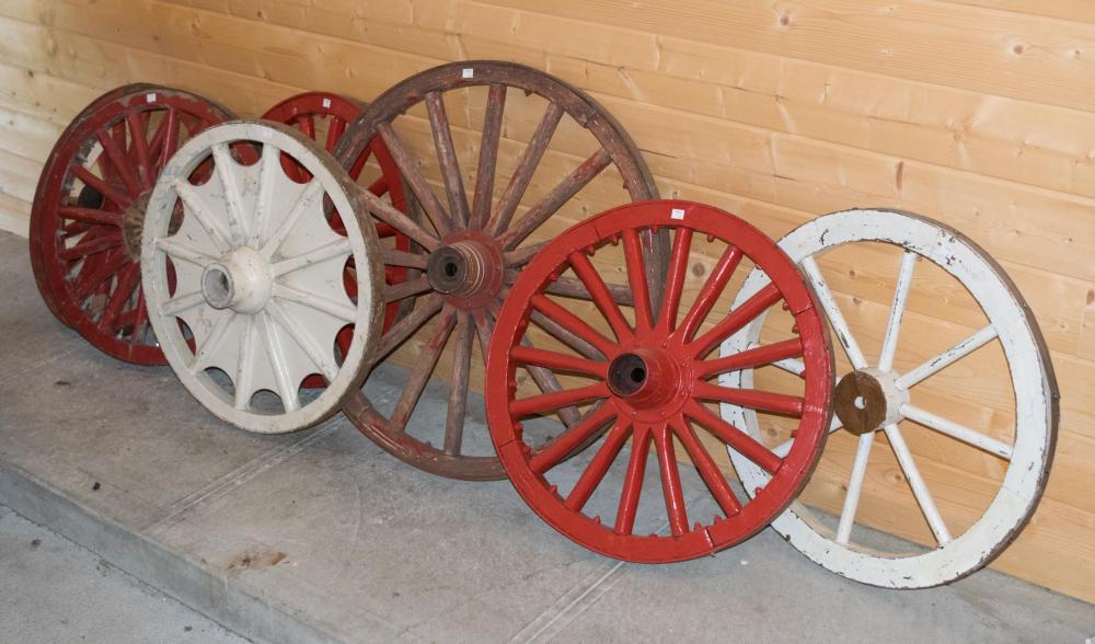 Appraisal: SEVEN SMALL WAGON WHEELS wood construction six with forged iron