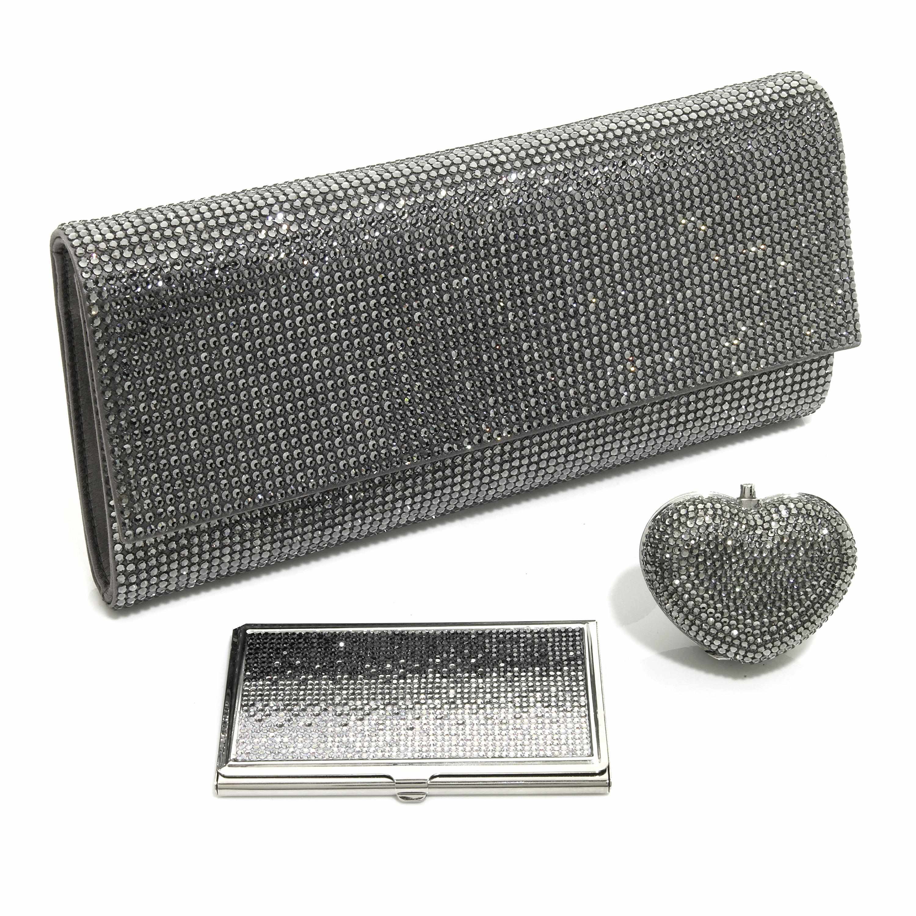 Appraisal: A pewter colored crystal envelope clutch together with a heart-shaped