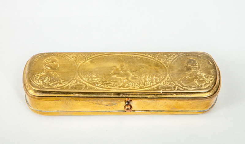 Appraisal: DUTCH RELIEF-DECORATED BRASS TOBACCO BOX With portrait rondels of 'Fredericus