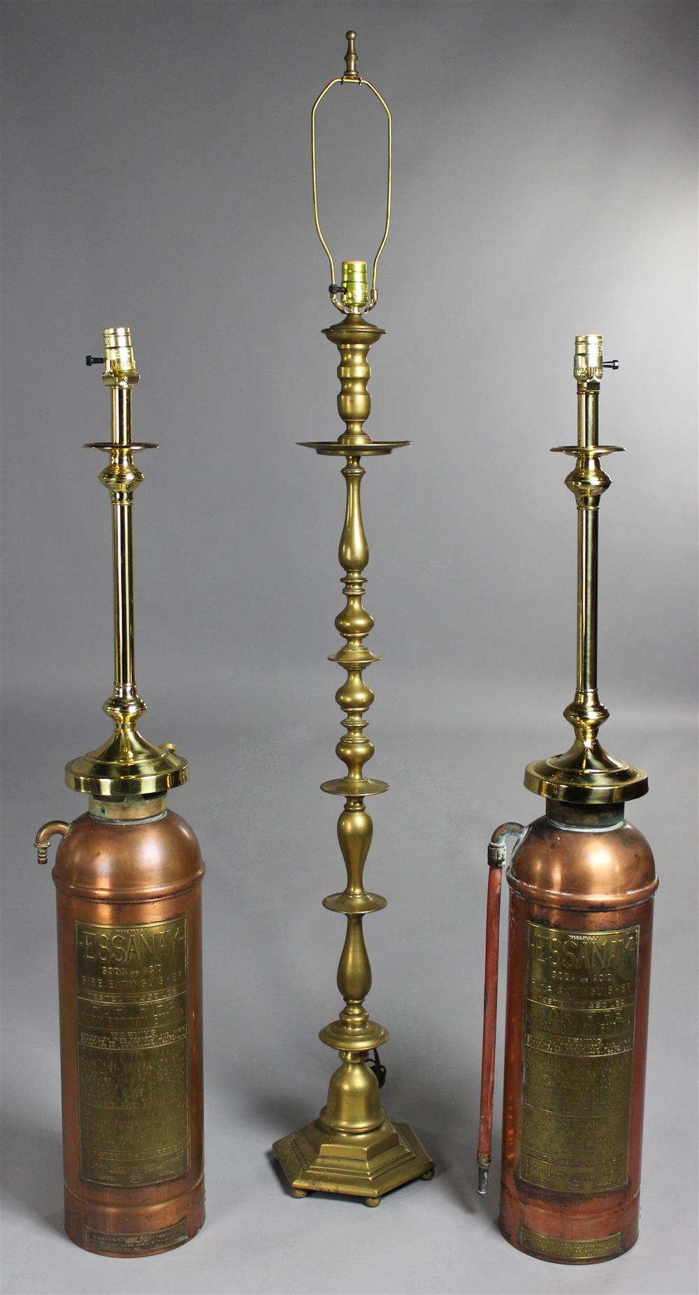 Appraisal: TWO ESSANAY COPPERED FIRE EXTINGUISHER TABLE LAMPS by the Pyrene