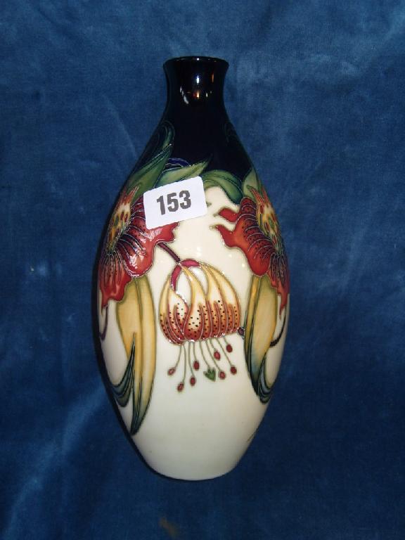 Appraisal: A Moorcroft cream ground vase in the Anna Lily pattern