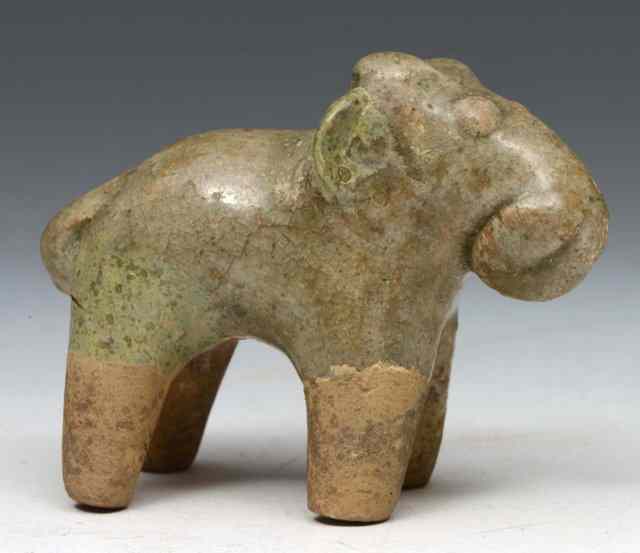 Appraisal: A CHINESE CELADON SMALL MODEL OF A STANDING ELEPHANT