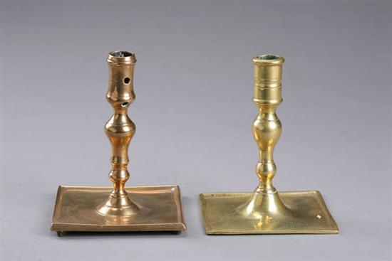 Appraisal: TWO BRASS CANDLESTICKS European th century Baluster form with square