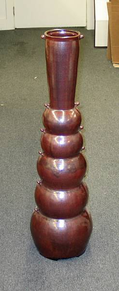 Appraisal: A Contemporary pottery ox blood glazed tall vase Composed of