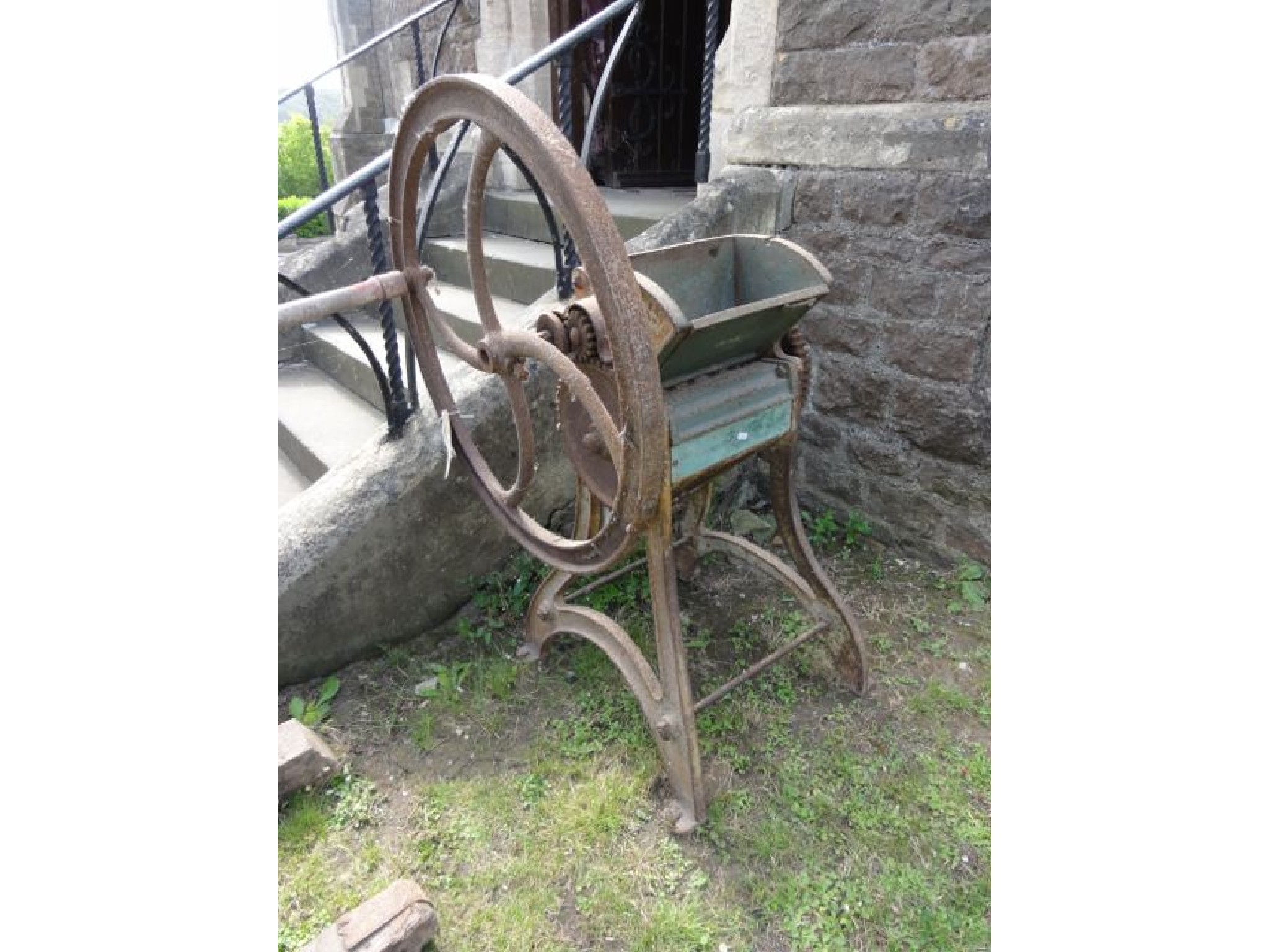 Appraisal: A vintage cast iron agricultural hand wheel driven chaff cutter