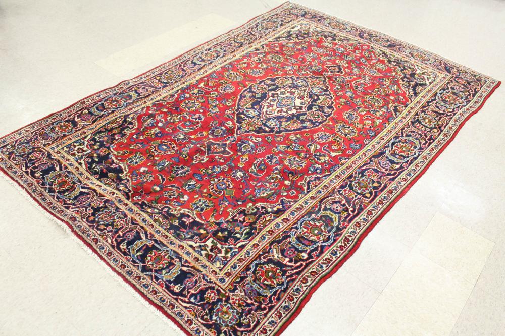 Appraisal: HAND KNOTTED PERSIAN RUG floral and central floral medallion design