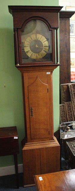 Appraisal: AN ANTIQUE OAK -HOUR LONG CASE CLOCK the arching dial