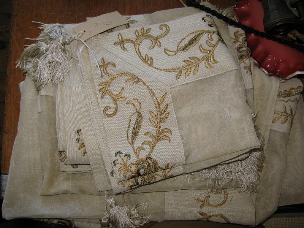 Appraisal: A set of five tablecloths with embroidered borders and tassles