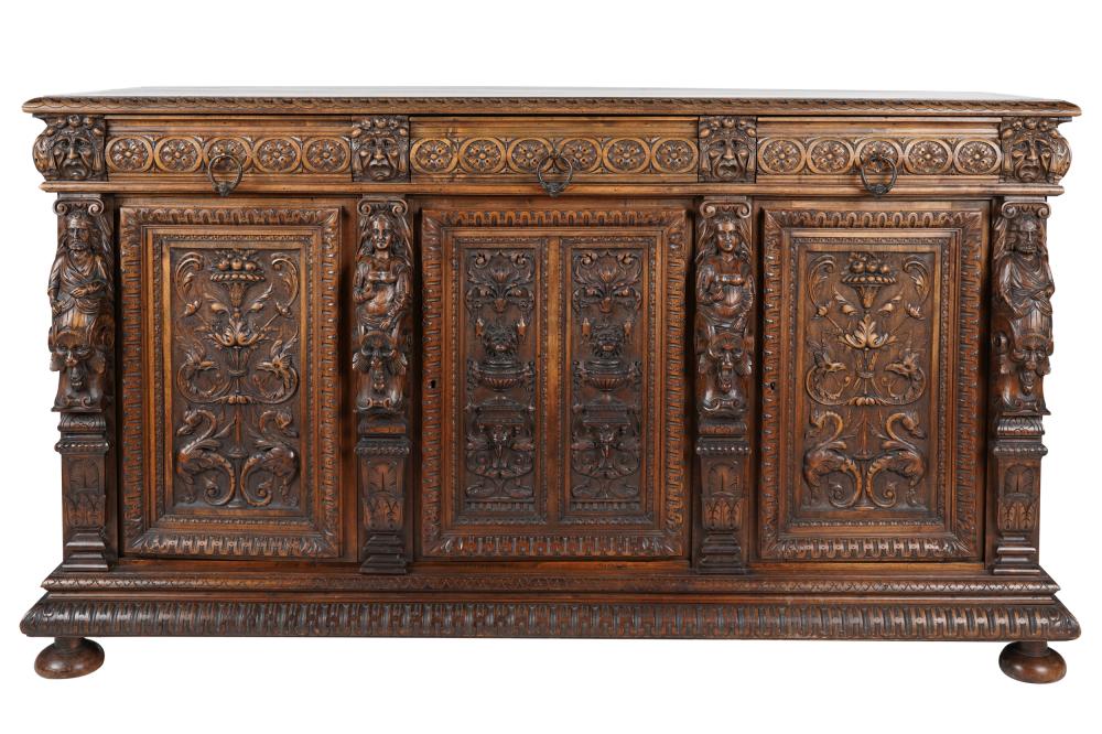 Appraisal: RENAISSANCE REVIVAL-STYLE CARVED WALNUT BUFFETwith three drawers above three hinged