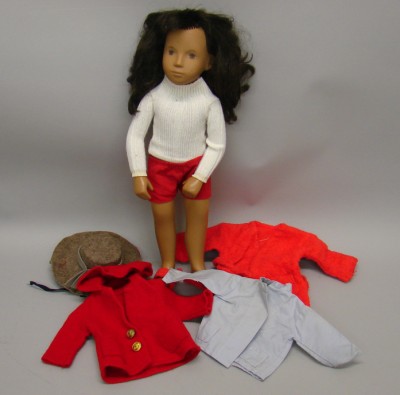 Appraisal: Vinyl girl with dark brown hair Doll comes with various