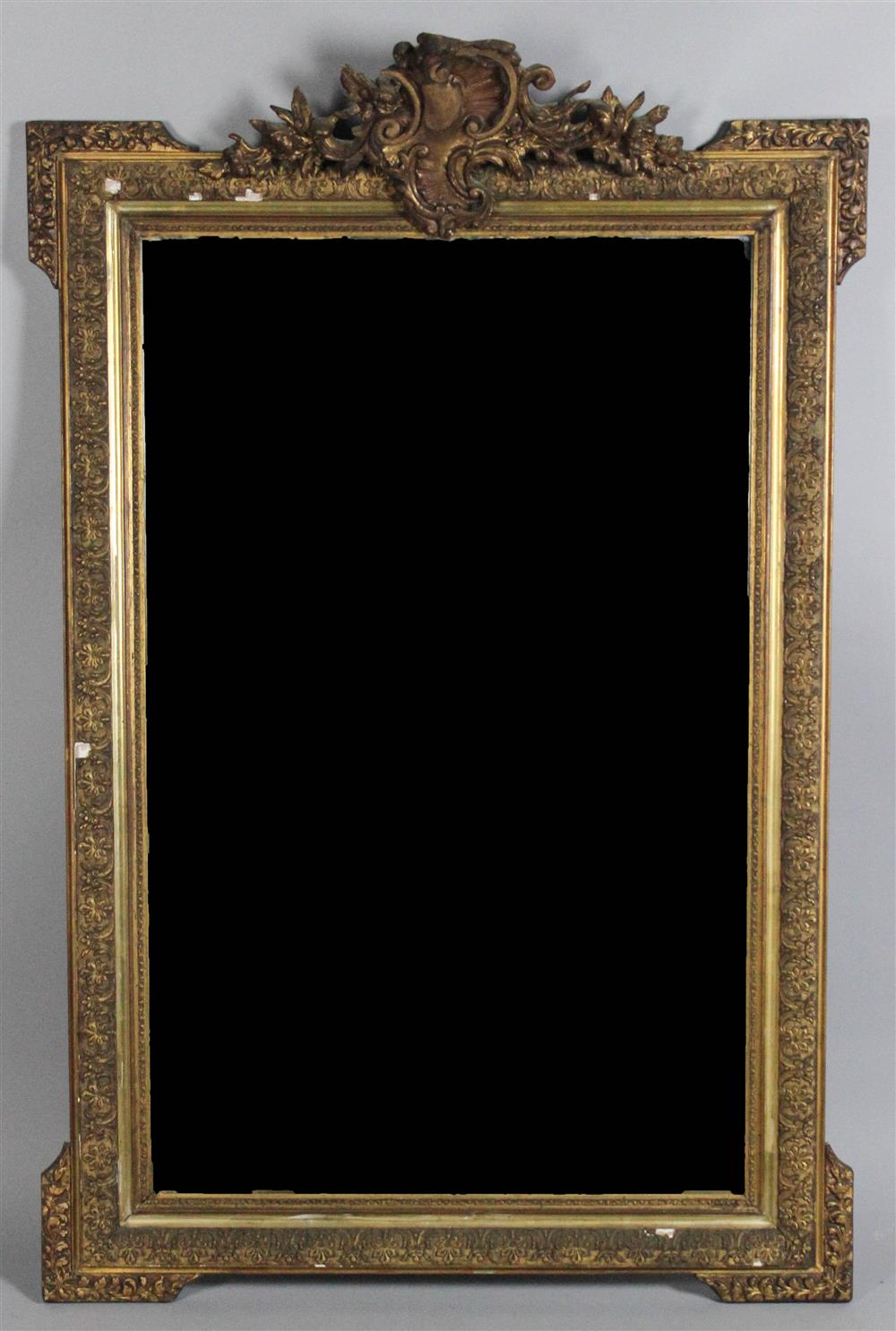 Appraisal: LARGE CARVED AND MOLDED GILTWOOD MIRROR the giltwood mirror with