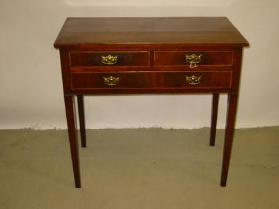 Appraisal: AN EDWARDIAN MAHOGANY SIDE TABLE of oblong form crossbanded with