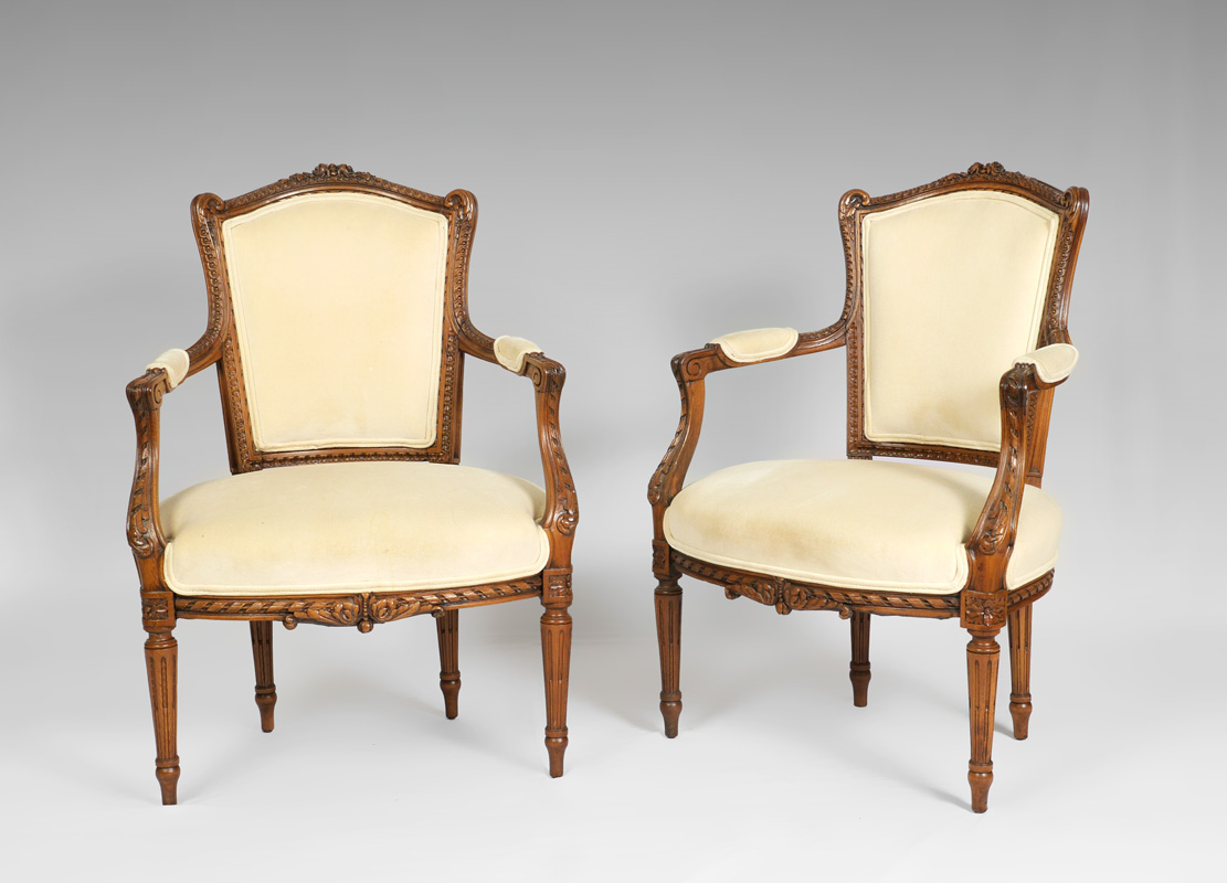 Appraisal: PAIR TH CENTURY FRENCH FAUTEUIL ARM CHAIRS Profusely carved and