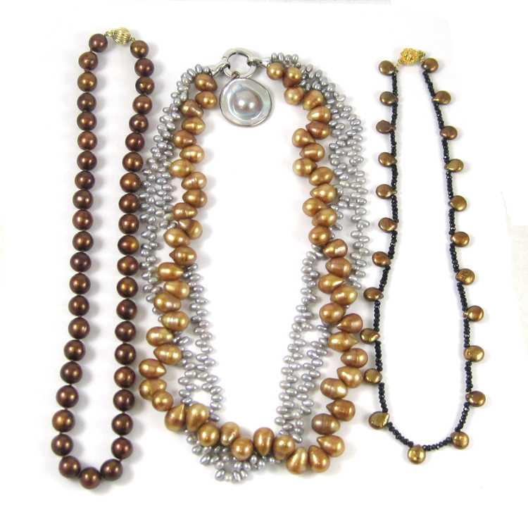 Appraisal: THREE PEARL BEADED NECKLACES the first with grey and orange-brown