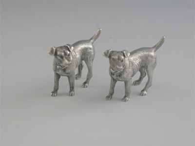 Appraisal: A pair of Edwardian cast novelty pepperettes in the form