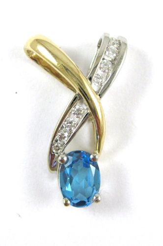 Appraisal: BLUE TOPAZ AND DIAMOND PENDANT The white and yellow gold