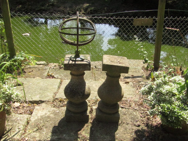 Appraisal: A stone baluster pedestal mounted with an orary by Westwood