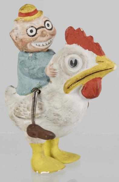 Appraisal: Composition Man Riding Chicken Candy Container Description German Wired mobile