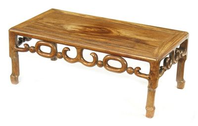 Appraisal: A Chinese hardwood low table the panelled top on an