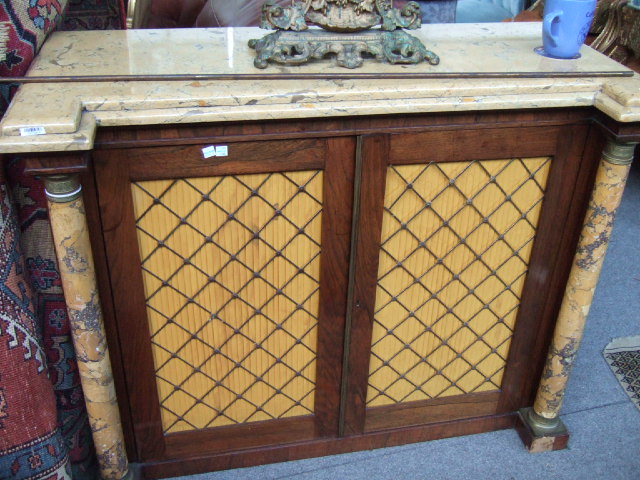 Appraisal: A Regency rosewood side cabinet the marble top over four